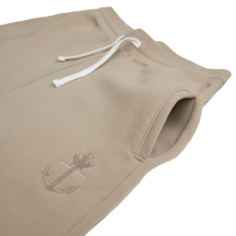 Latte coloured Canadian made joggers. Slim fitting with tone on tone embroidered logo. Polyester/cotton blend