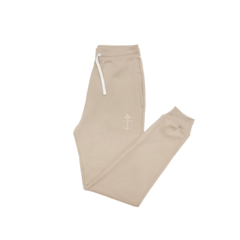 Latte coloured Canadian made joggers. Slim fitting with tone on tone embroidered logo. Polyester/cotton blend